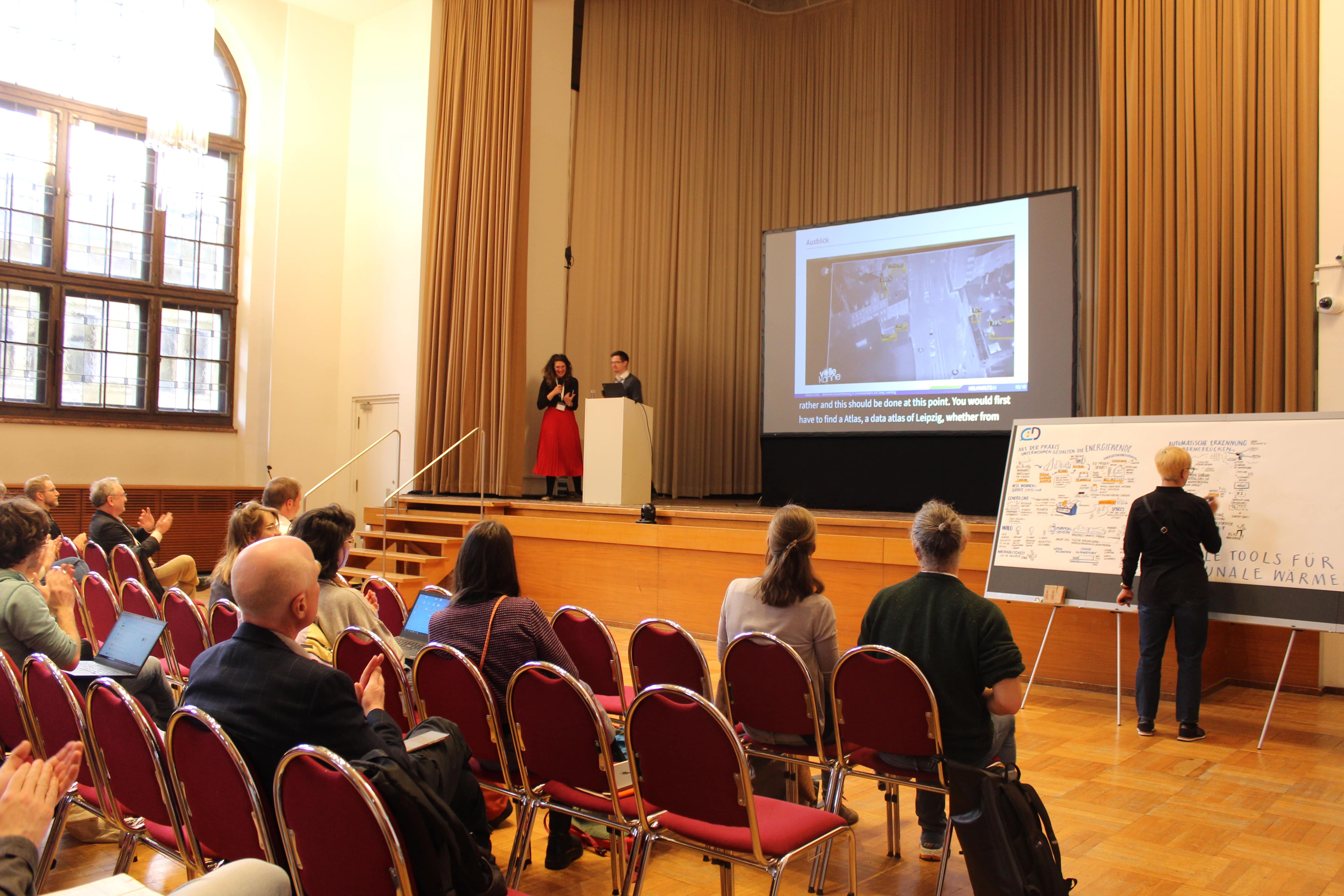 Presenter during a talk at Festsaal.